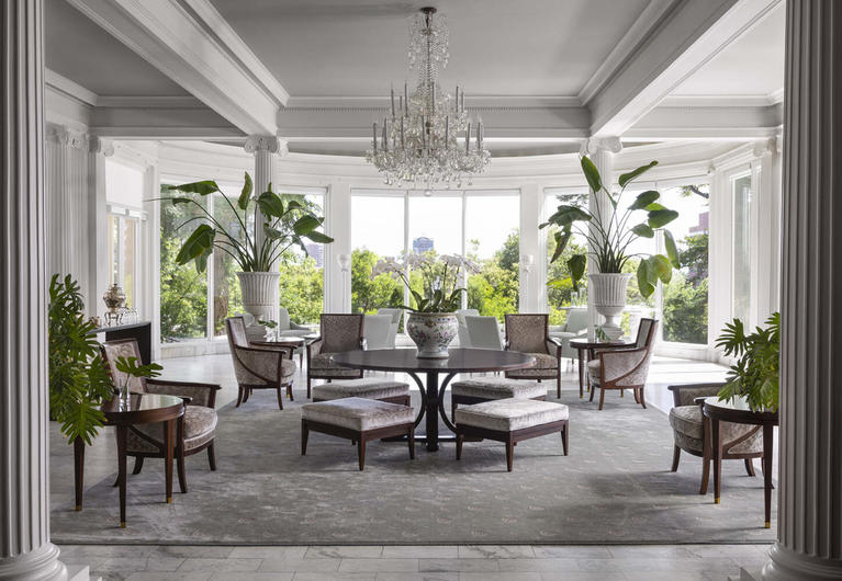 The Palm Room: a large, brightly lit open concept seating area