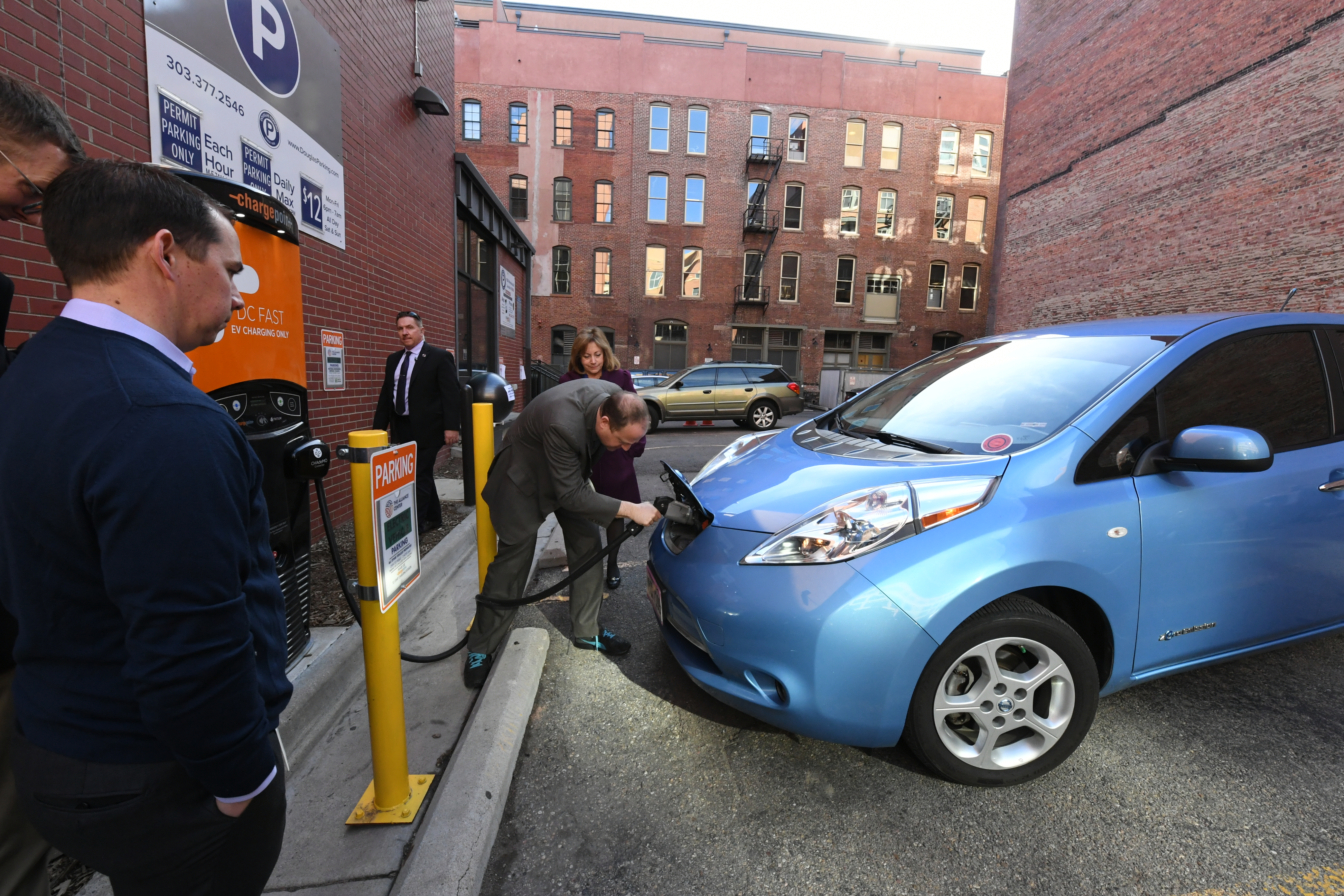 Governor Polis Plugging In an Electric Car