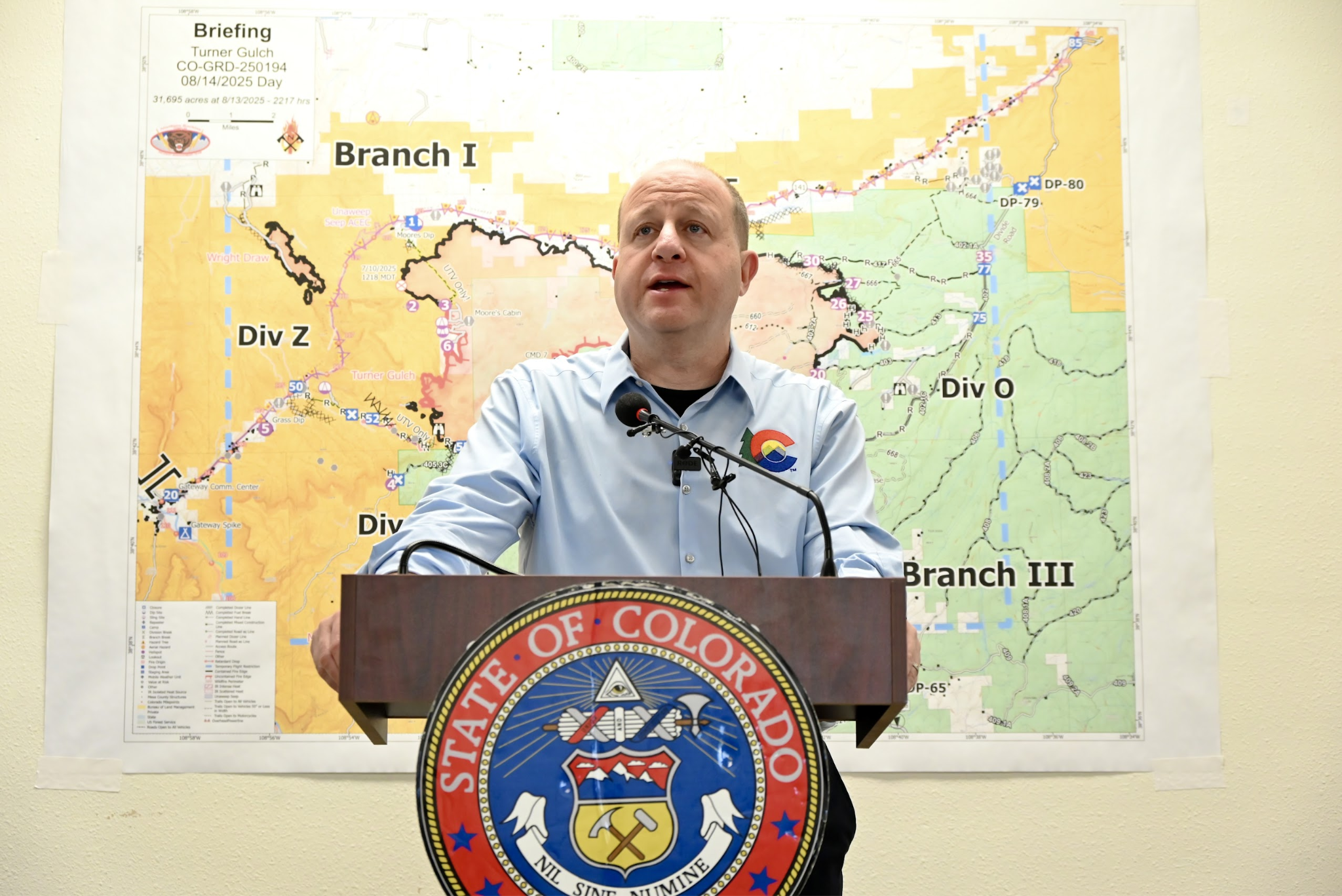 Governor Polis speak to press at Turner Gulch Command Center