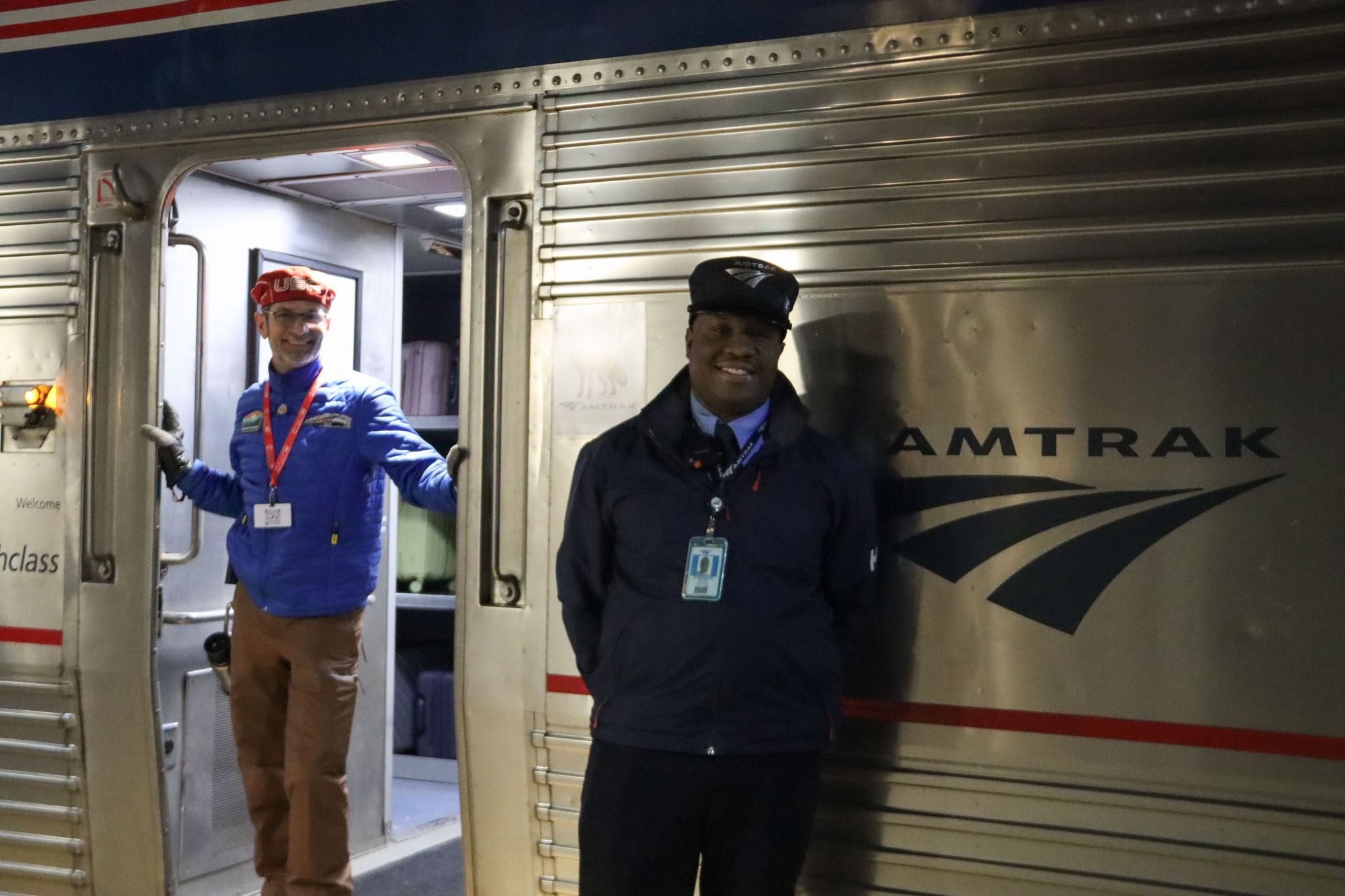 Conductor for Winter Park Express Train smiles on platform
