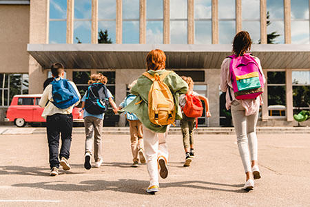Children walking into school building